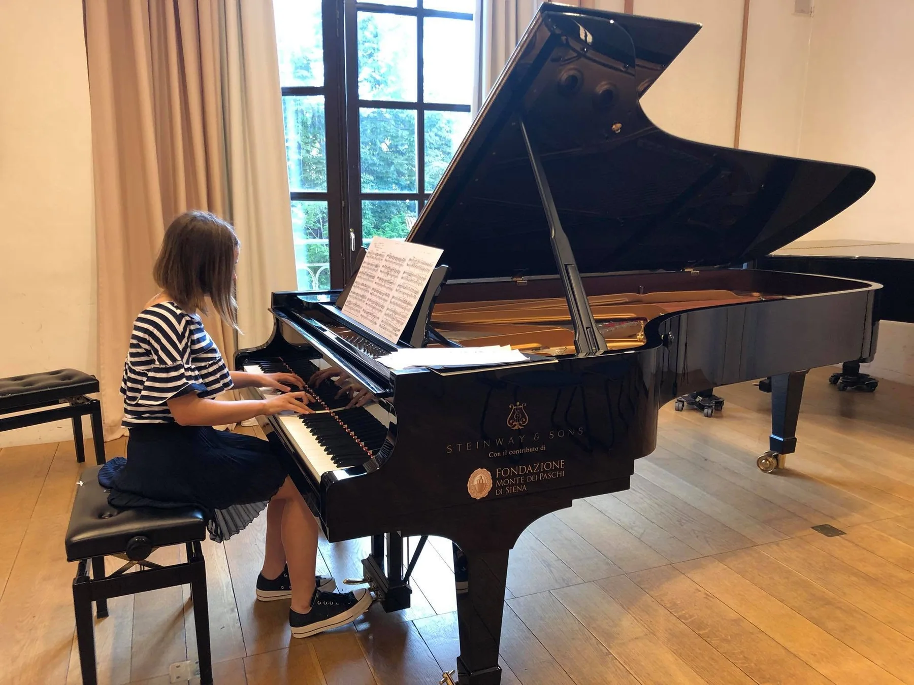 Momento di esame al pianoforte in Conservatorio